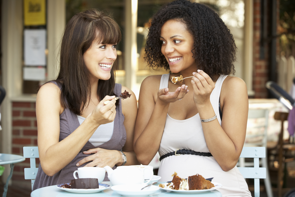 Two friends eating dessert at t Eclectic Kitchen on N. Garland Ave in Fayetteville AR.