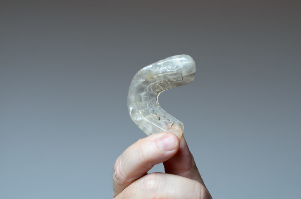 Image of a mouth guard which can help alleviate TMJ symptoms.